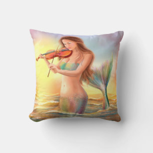 Pillow fantasy mermaid plays on violin on sunset