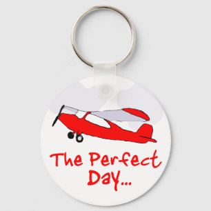 pilot flyling red aeroplane key ring