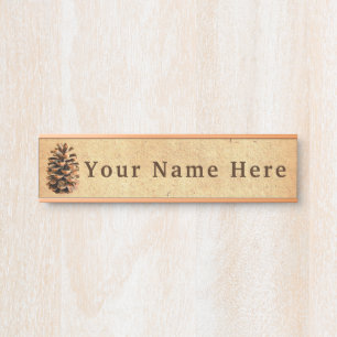 Pine Cone On Old Paper Door Sign