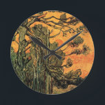 Pine Trees Red Sky Setting Sun by Vincent van Gogh Round Clock<br><div class="desc">Pine Trees against a Red Sky with Setting Sun by Vincent van Gogh is a vintage fine art post impressionism landscape nature painting. A pine tree forest with a glowing red and orange sky at sunset. The sun is glowing through the evergreen tree branches, pine cones and needles in the...</div>