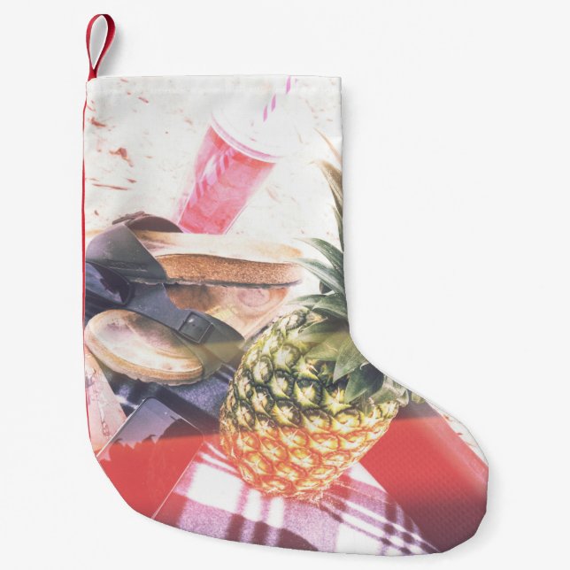 Pineapple beside phone and speaker small christmas stocking (Front)