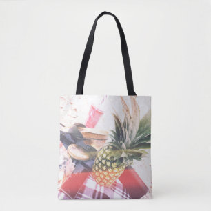 Pineapple beside phone and speaker tote bag