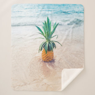 Pineapple fruit on beach shore in the morning sherpa blanket
