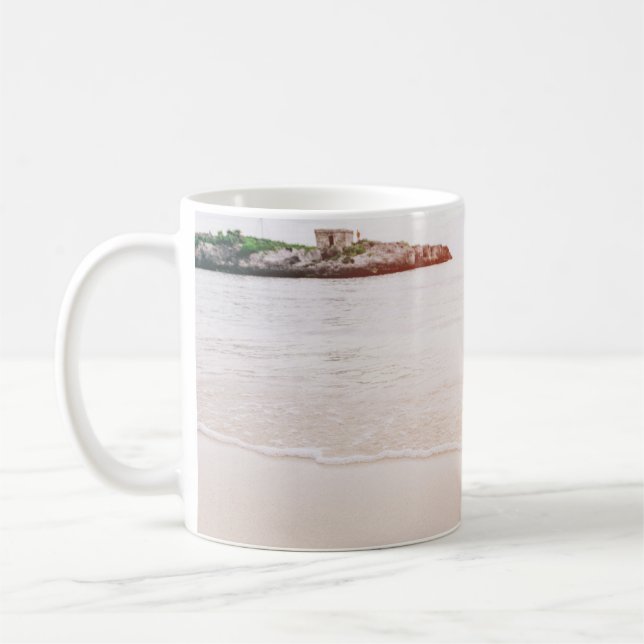 Pineapple on sand near beach coffee mug (Left)