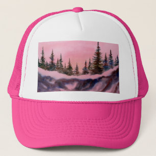 Pines on a snow covered ridge in pink sunrise trucker hat