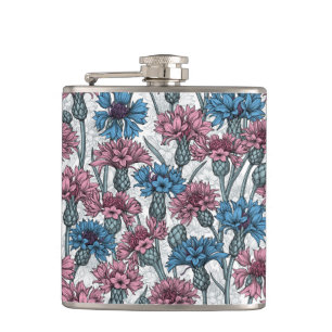Pink and blue cornflowers, wild flowers on white hip flask