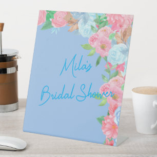pink and blue floral pedestal sign