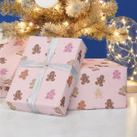 Pink and Brown Gingerbread Men Pink Christmas Wrapping Paper<br><div class="desc">Introducing our Modern Light Brown Christmas Wrapping Paper, a delightful choice to elevate your holiday presents with a touch of contemporary charm! The warm and inviting light brown background sets the perfect backdrop for your festive gifts, evoking the cosy ambiance of a winter cabin bathed in soft, golden light. Adorned...</div>
