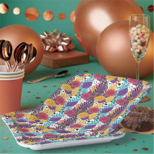 Pink and purple cut flowers with intricate petals  paper plate