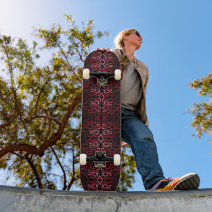 Pink And Red Dots And Squiggles Pattern On Black Skateboard