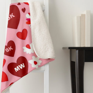 Pink and red hearts and flowers motif and initials sherpa blanket