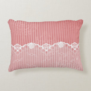 Pink and white background with black lace decorative cushion