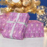 Pink and White Christmas Trees Green Christmas Wrapping Paper<br><div class="desc">Introducing our Modern Christmas Wrapping Paper, a whimsical and enchanting choice for your holiday gift-giving. This wrapping paper features a rich purple background adorned with a delightful pattern of super cute Christmas trees in shades of pink, beige, and white. Among these charming trees, you'll find intricate snowflakes, gentle falling snow,...</div>