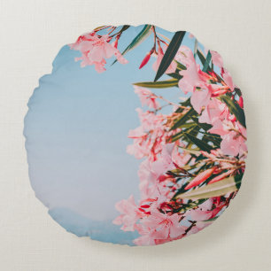 Pink and white petaled flowers round cushion