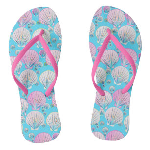 Pink and white sea shells on turquoise jandals