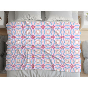Pink, blue and white geometric patterned fleece blanket