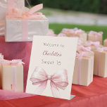 Pink bow cream beige Sweet 16 welcome Pedestal Sign<br><div class="desc">A stylish cream,  beige background decorated with a large pink bow.   Personalise and add a name.</div>