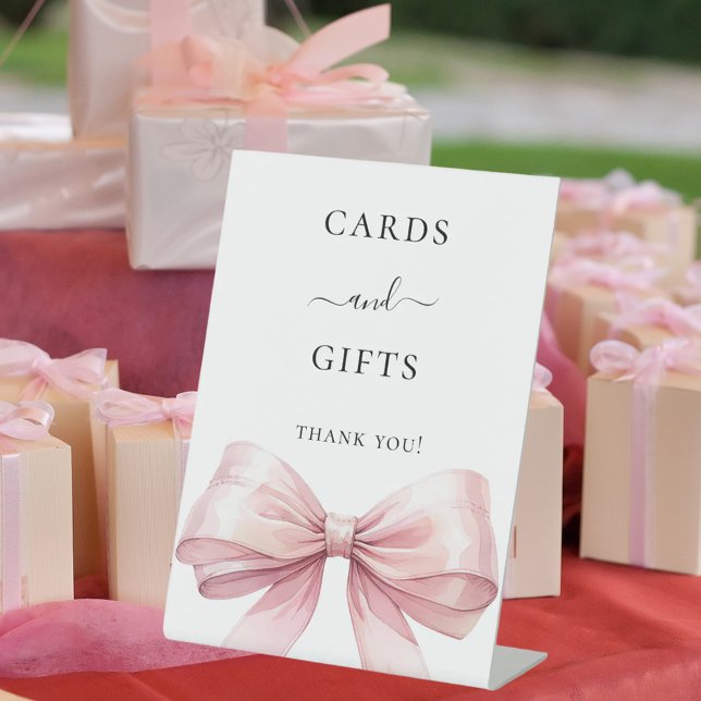 Pink bow white cards gifts sign (Creator Uploaded)