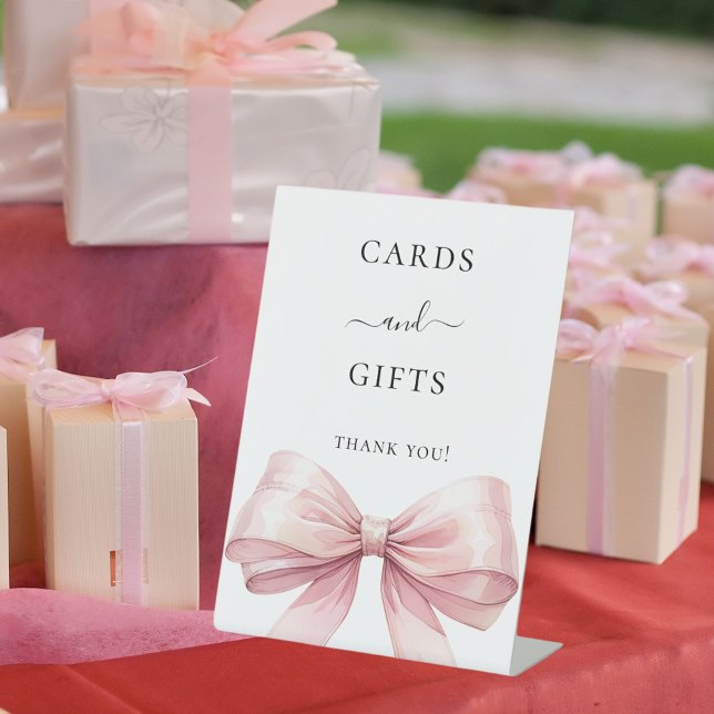Pink bow white cards gifts sign (Creator Uploaded)