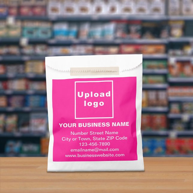 Pink Business Brand on Paper Bag (Paper bag with pink business branding displayed in a store)