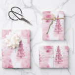 Pink Christmas wrapping paper for gifts<br><div class="desc">This beautiful wrapping paper features soft pink trees amidst gentle watercolor splashes,  creating a whimsical holiday atmosphere perfect for enveloping Christmas gifts with charm.</div>