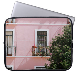 PINK CONCRETE COMMERCIAL BUILDING NEAR GREEN TREE LAPTOP SLEEVE