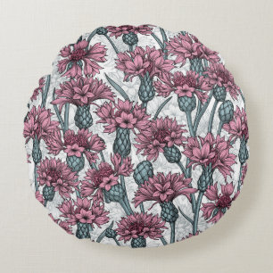Pink cornflowers, wild flowers on white round cushion