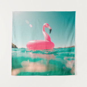 Pink flamingo swim ring on body of water in summer tapestry