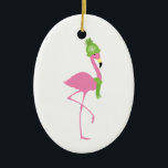 Pink Flamingo Winter Christmas Ornament<br><div class="desc">A Christmas ornament featuring an illustration of a pink flamingo wearing a green scarf and matching snowflake hat.</div>