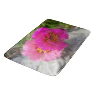 Pink flowers in the sun bath mat