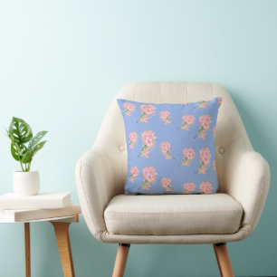 Pink flowers on blue cushion