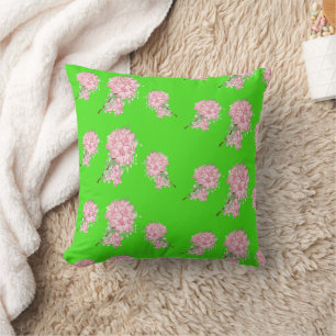 Pink flowers on green cushion