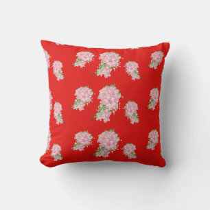 Pink flowers on red cushion