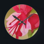 Pink Fuchsia pop art watercolour flower Round Clock<br><div class="desc">From an original watercolour painting of a bright pink fuchsia flower in vivid pop art style against a golden background. This design is arty and bright and would bring a pop of pop art colour to any situation.</div>