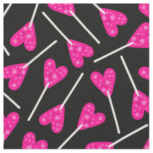pink heart shape lollipop candy black fabric
