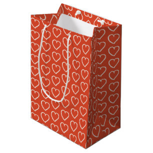 Pink hearts on red medium gift bag