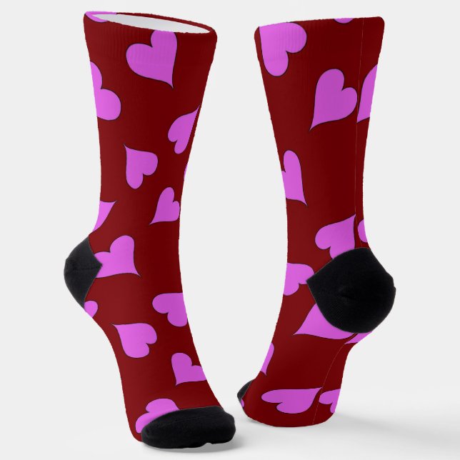 Pink hearts pattern on red socks (Angled)