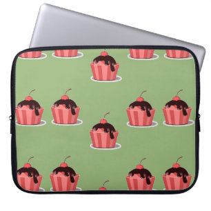 Pink ice cream cups on green laptop sleeve
