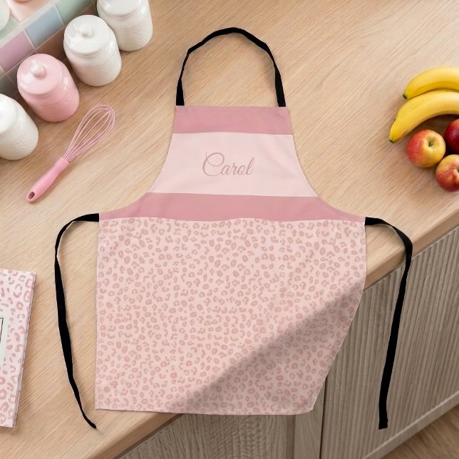 Pink Leopard Print with Name Striped Cheetah Apron (Pink leopard print pattern personalized apron on a feminine pastel-decorated kitchen counter.)