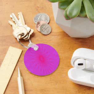 Pink mandala rays on purple keychain