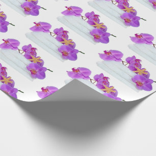 pink orchids on white towels with starfish wrapping paper