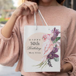 Pink Parrot Boho Tropical 50th Birthday Party Medium Gift Bag<br><div class="desc">Add a memorable personal touch to a 50th birthday celebration with this custom gift bag. The theme is boho tropical floral and is fabulous! A pale rose beige round frame surrounds the text along with a beautiful pink parrot sitting atop a bouquet of tropical floral elements that include purple protea...</div>