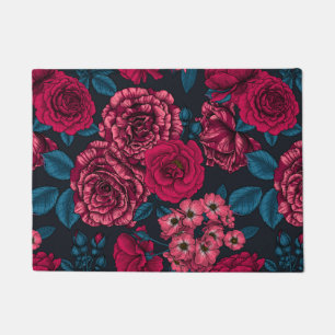 Pink, red and bi-colour roses with blue leaves on doormat