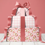 Pink Retro Vintage Santa Christmas Wrapping Paper Sheet<br><div class="desc">Wrap your holiday gifts in timeless cheer with this delightful red retro vintage Santa wrapping paper. It features a charming assortment of classic Christmas patterns, including festive snowflakes, cosy red gingham, and adorable vintage Santa Claus faces. The modern pink and white palette instantly evokes nostalgic warmth and holiday spirit, perfect...</div>