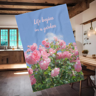 Pink rose bush under blue sky, custom tea towel