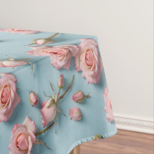 Pink Roses Scattered Across Light Blue Background Tablecloth