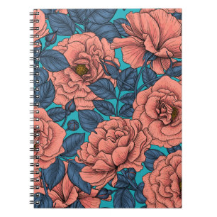 Pink roses with blue leaves on blue notebook