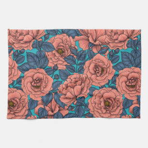 Pink roses with blue leaves on blue tea towel