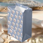 Pink Sea Star Ornament dusty blue pattern Medium Gift Bag<br><div class="desc">Wrap your gifts with seaside charm using our Pale Pink Sea Star Ornament Pattern on Dusty Blue gift bag! This elegant gift bag beautifully blends coastal style and festive Christmas spirit, featuring a delicate watercolor pattern of pale pink sea star ornaments set against a serene dusty blue background. Perfect for...</div>