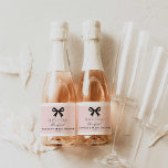 Pink She's Tying the Knot Sparkling Wine Label<br><div class="desc">Celebrate in style with these pink 'She’s Tying the Knot' mini champagne labels featuring a chic bow design. Perfect for bridal shower favours,  these elegant labels are customisable with the bride’s name and party details to add a personal touch. Check out our matching items</div>